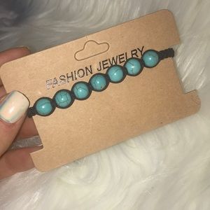 Braided bracelet with teal beads